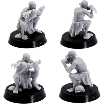 Crouching ghoul miniature holding and biting a large bone.