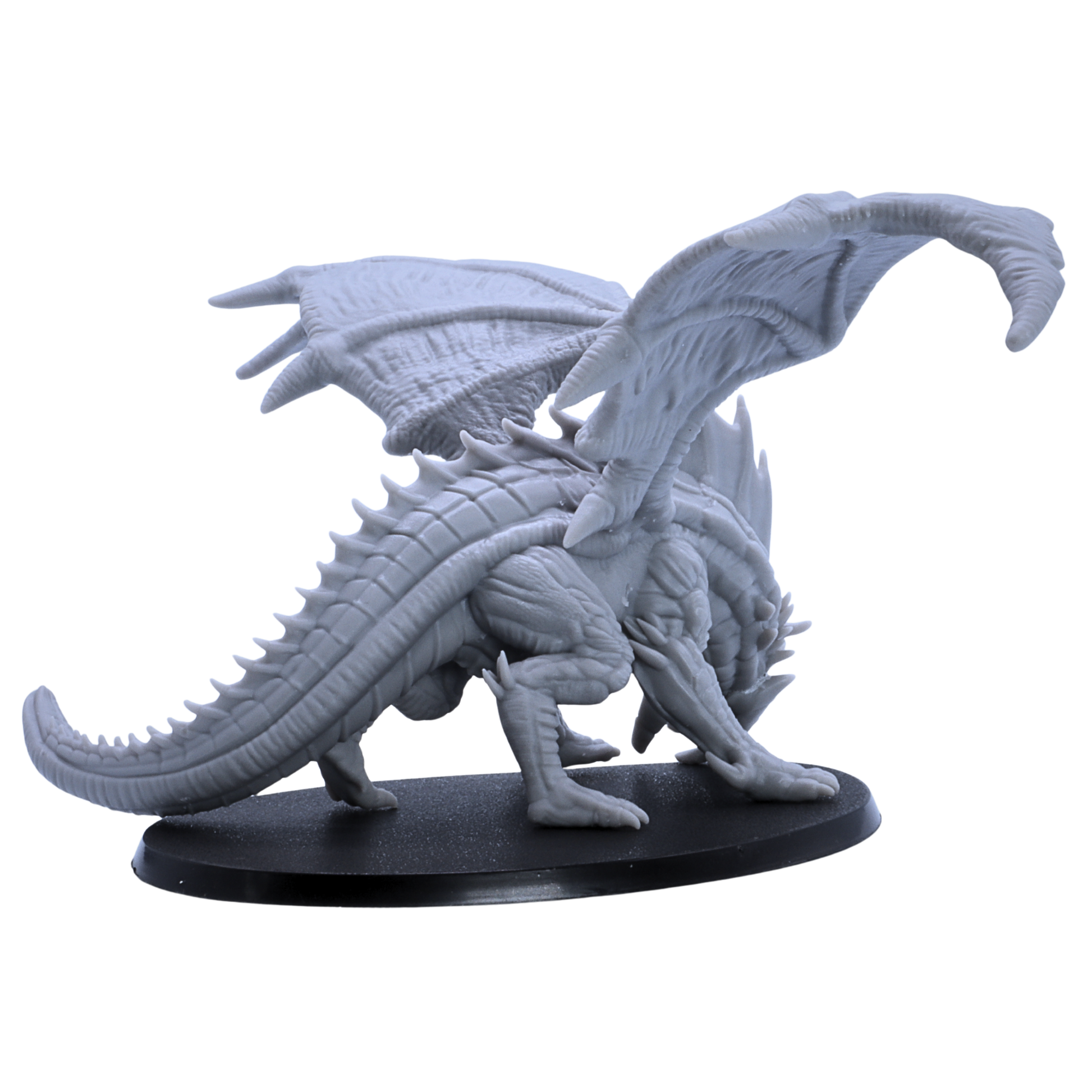 Overhead view of unpainted Giant Red Dragon miniature showing wide wingspan and large oval base.