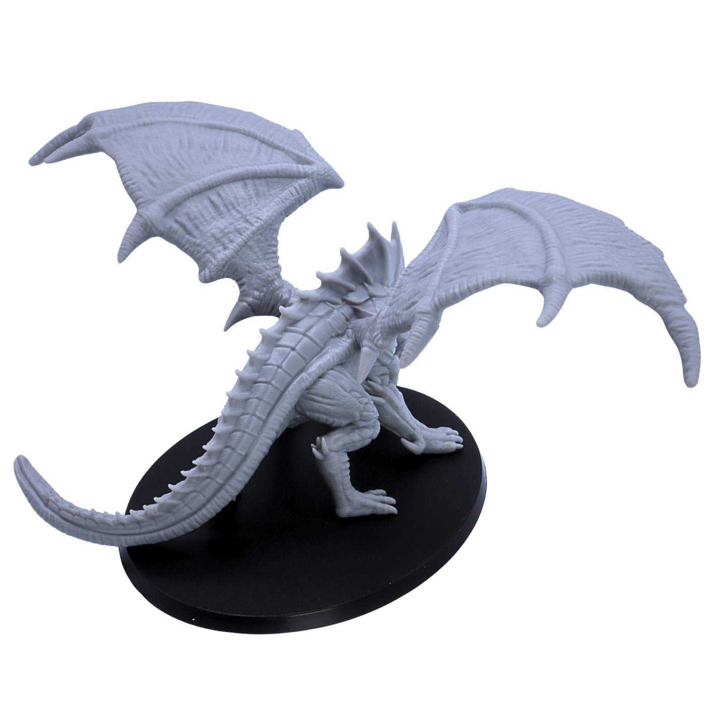 Rear overhead view of unpainted Giant Red Dragon miniature showing wing texture, long tail, and 120mm oval base.