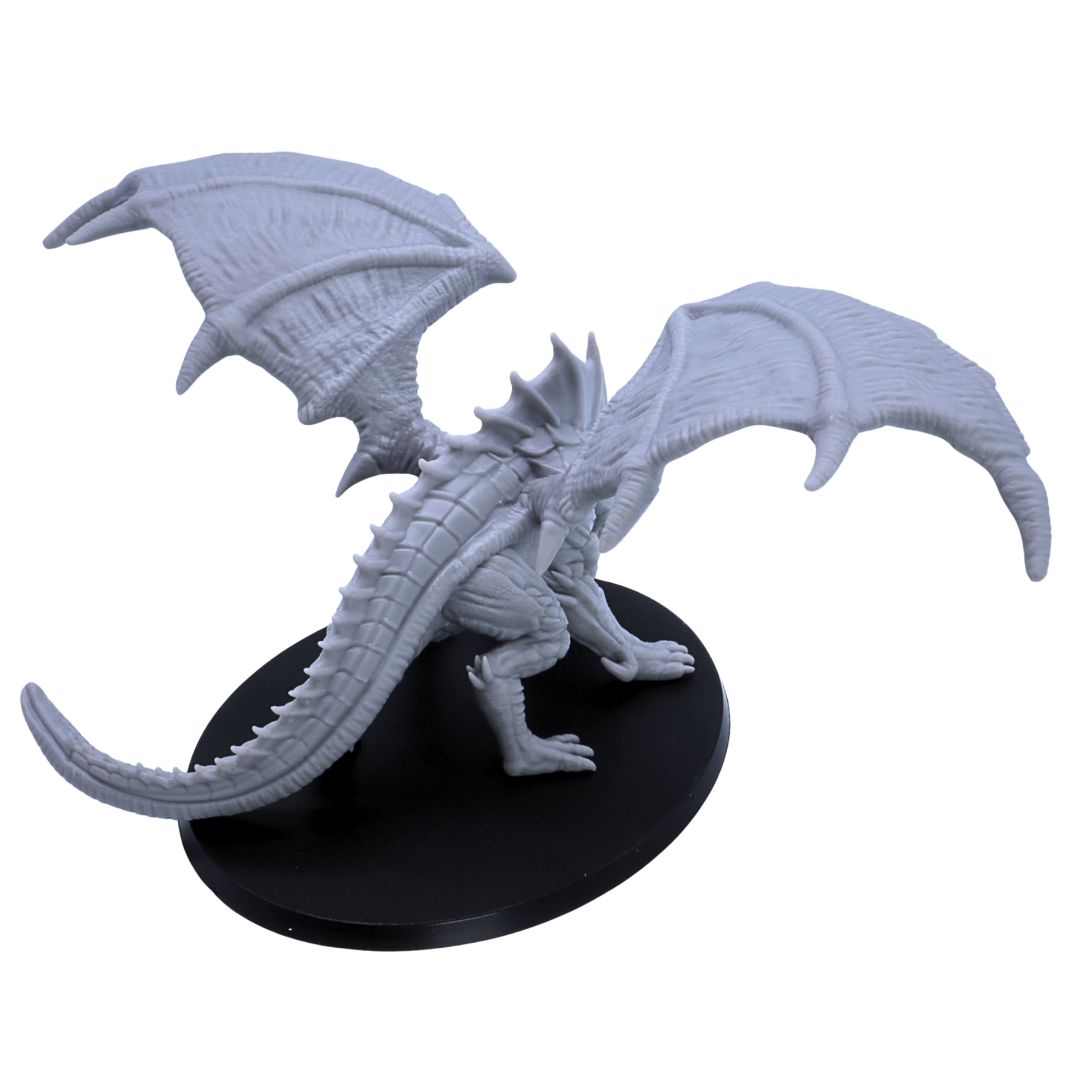 Rear overhead view of unpainted Giant Red Dragon miniature showing wing texture, long tail, and 120mm oval base.