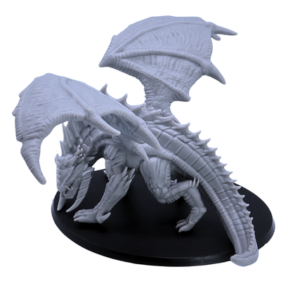 Rear side view of unpainted Giant Red Dragon miniature showing spiked back, tail, wings, and crouched dragon pose.