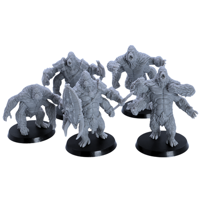 Group view of unpainted Girallon miniatures showing different poses, including armoured, roaring, and crouching variants.
