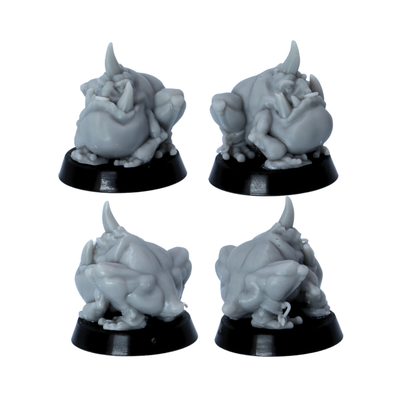 Unpainted squat tusked goblin creature miniature shown from multiple angles on a round base.