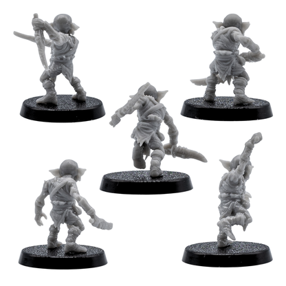Rear views of unpainted Goblin fantasy miniatures showing clothing, weapons, poses, and resin sculpt detail.