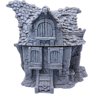 Rear view of the Hagglethorn Cottage showing boarded windows and detailed roof construction.