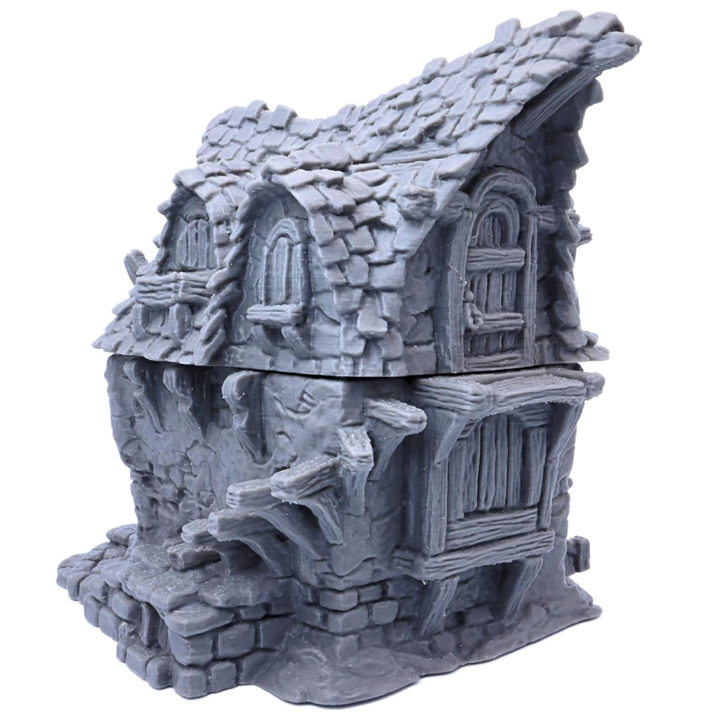 Unpainted Hagglethorn Cottage showing the detailed stone walls, timber supports and tiled roof.