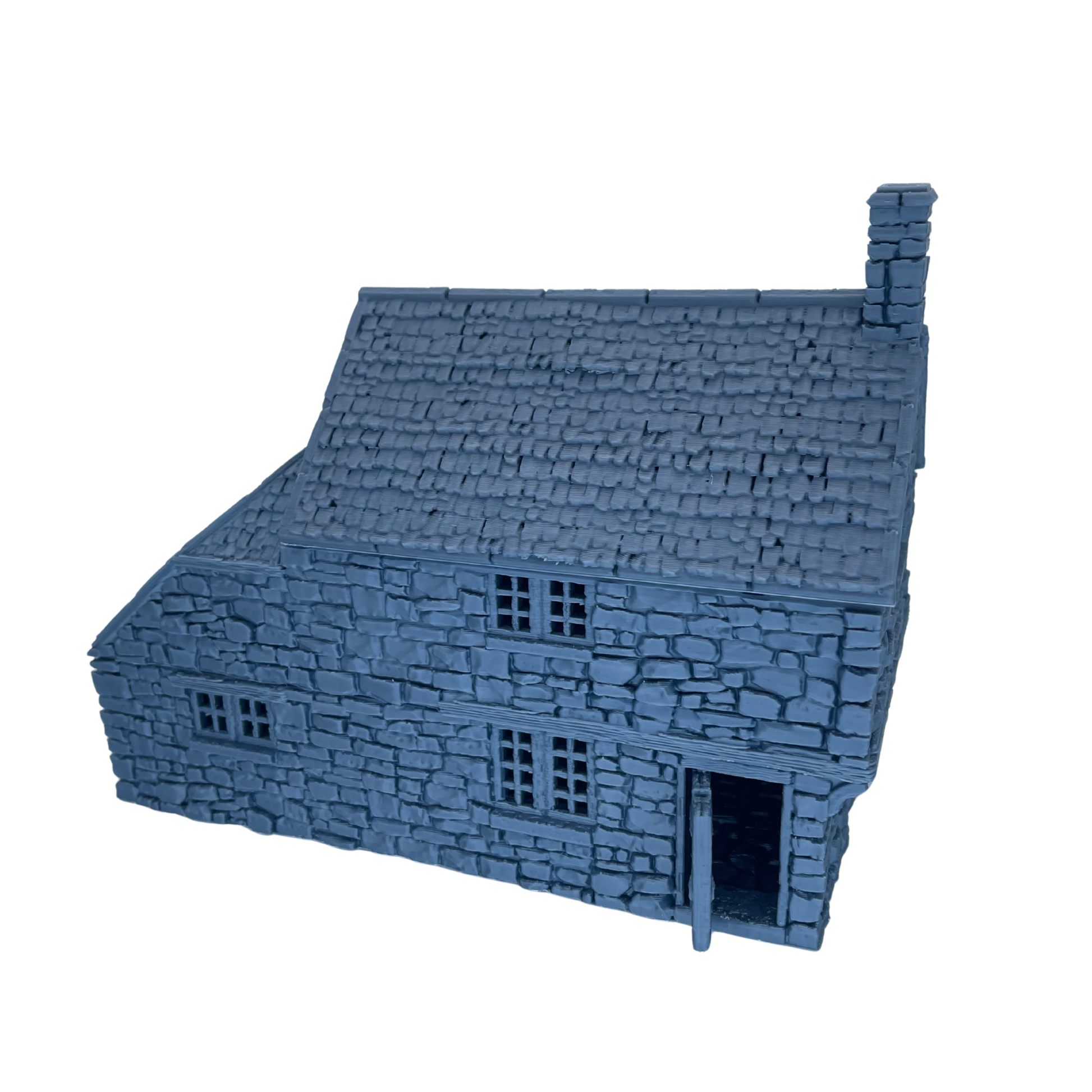 Unpainted Hollyhock Cottage shown from the front with stone walls, windows, tiled roof, chimney, and doorway.
