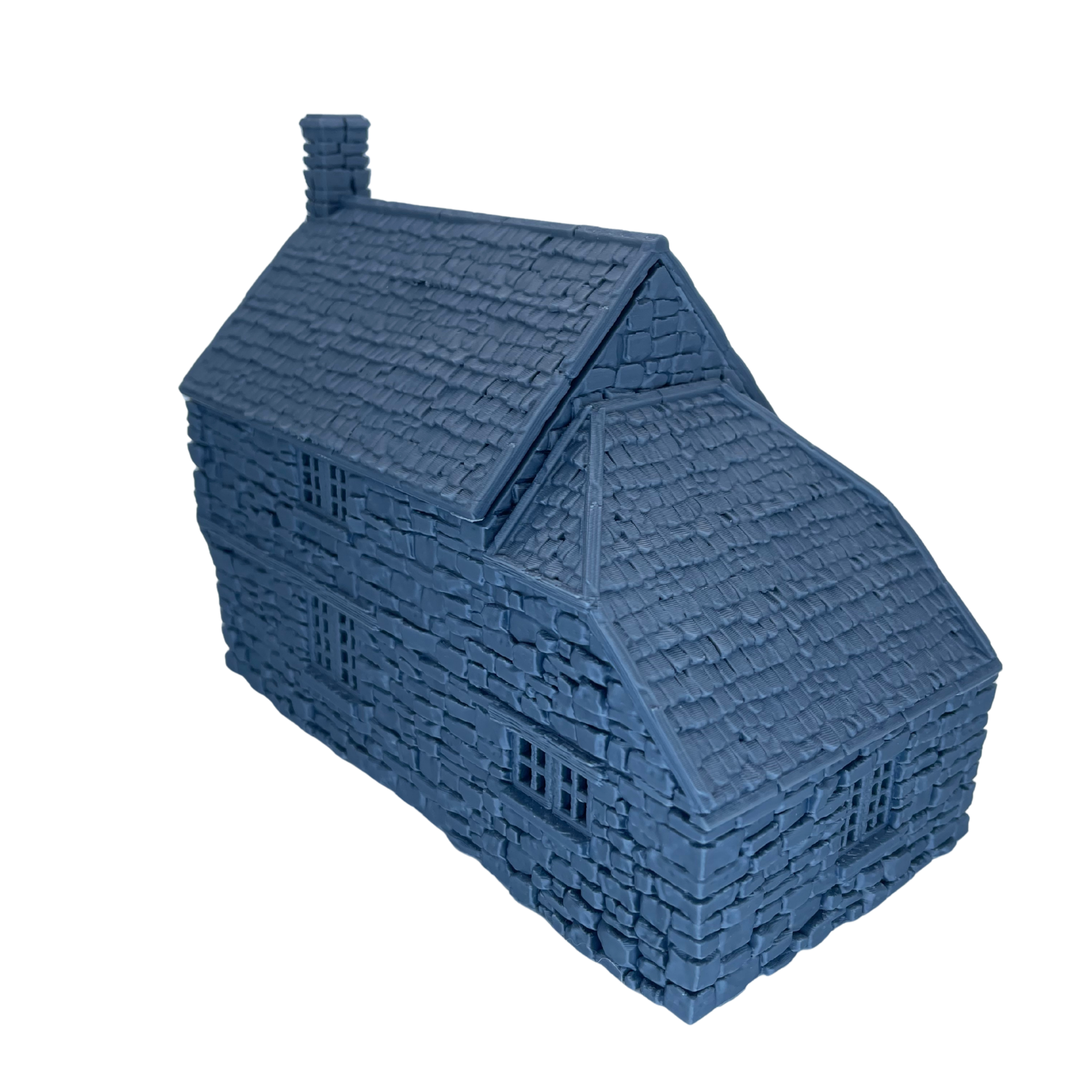 Unpainted side view of Hollyhock Cottage showing the extended roof section and detailed stone construction.