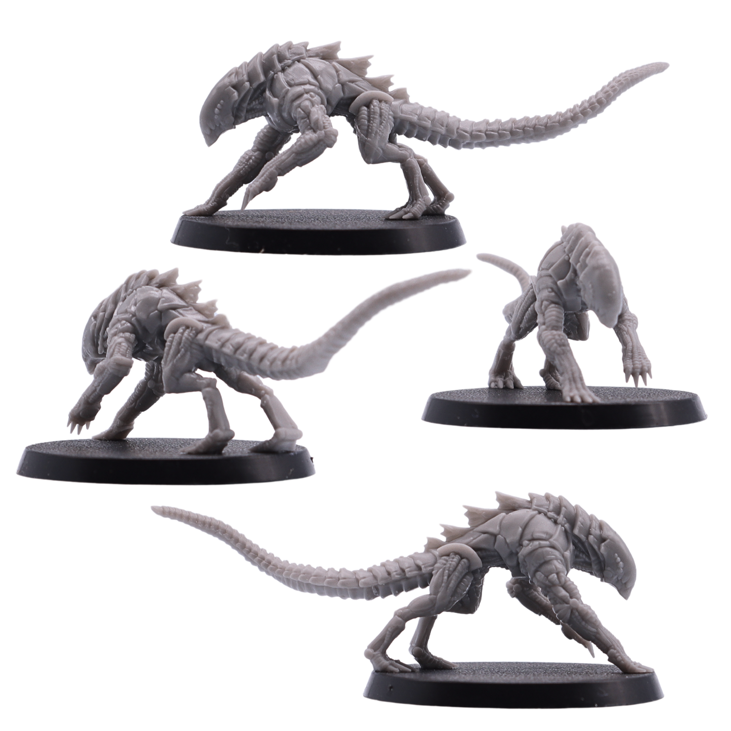 Side views of unpainted Hounds of Tindalos miniatures showing long tails, clawed limbs, and armoured alien bodies.