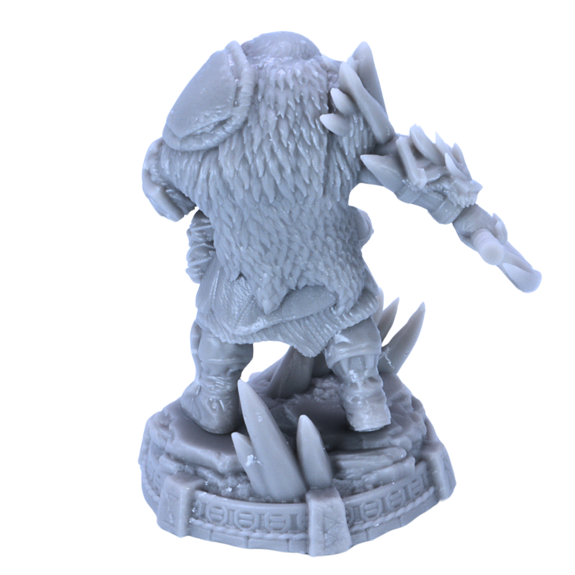 Rear view of unpainted Icebjorn Horgast miniature showing fur cloak, shoulder armour, axe, and base details.
