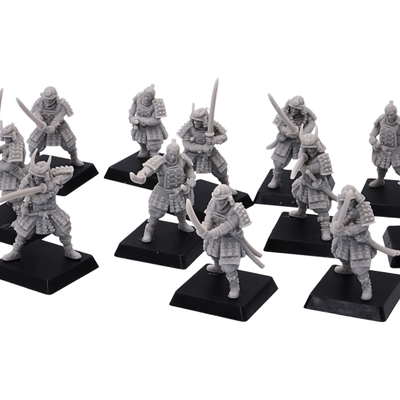 Close-up of unpainted Japanese Samurai Swordsmen miniatures showing armor, helmets, swords, and dynamic warrior poses.