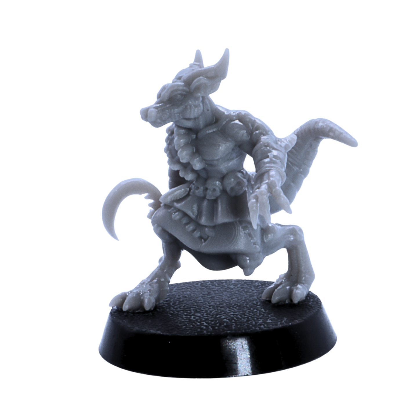Close view of unpainted kobold warrior miniature with claws, horns, and curved tail.