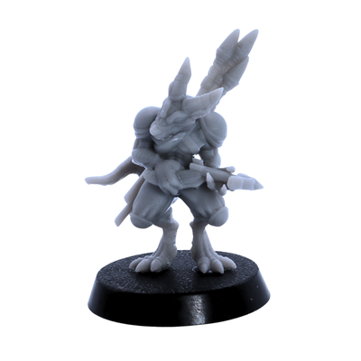 Unpainted kobold miniature with crossbow and horned reptilian head on a round base.