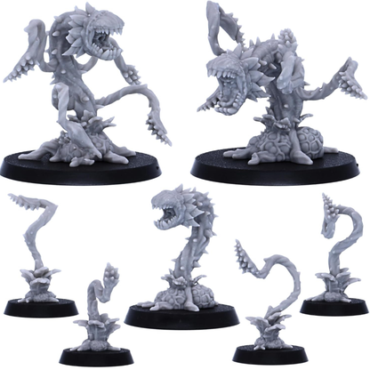 Collection of Man Eating Plant miniatures including larger monsters and smaller plant sprouts.