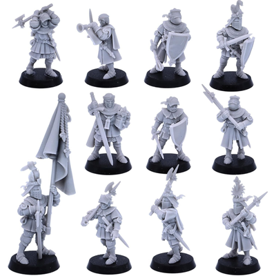 Eleven unpainted Medieval Knights on Foot displayed together with varied medieval weapons and armour.
