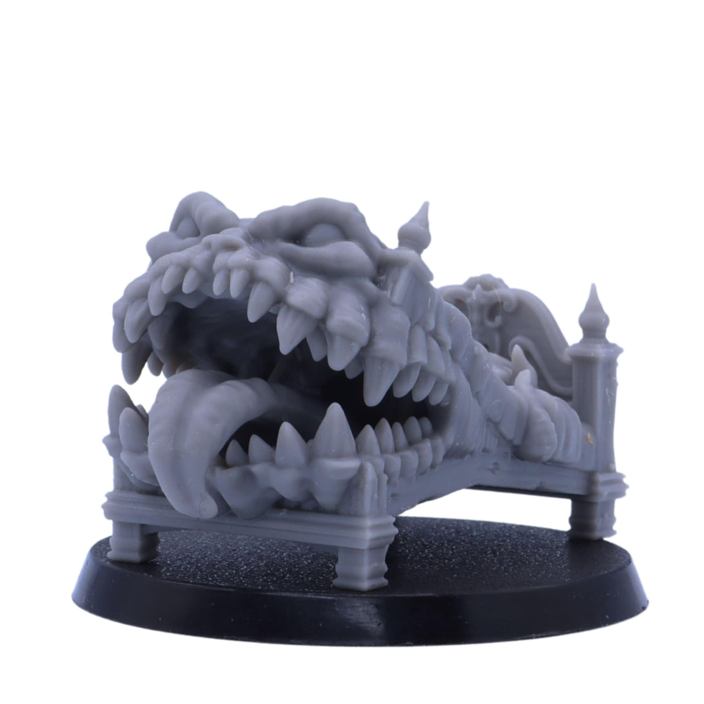 Fantasy bed Mimic miniature transformed into a monster with large teeth and a long tongue.