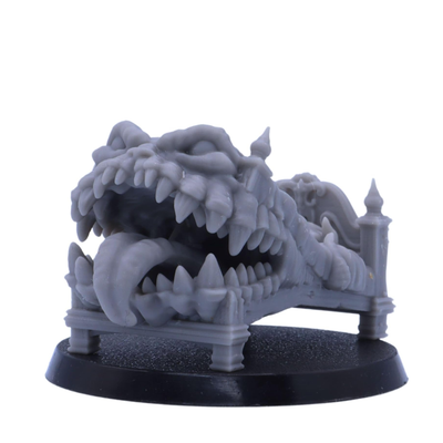 Fantasy bed Mimic miniature transformed into a monster with large teeth and a long tongue.