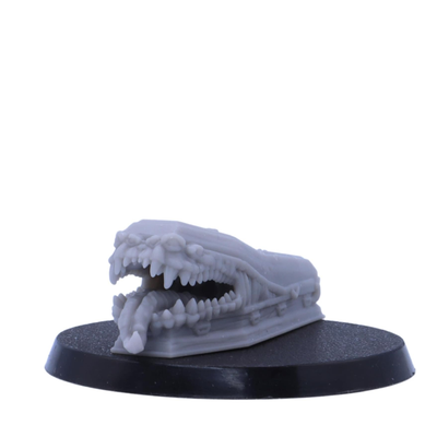 Coffin Mimic miniature with an open monstrous mouth and tongue.