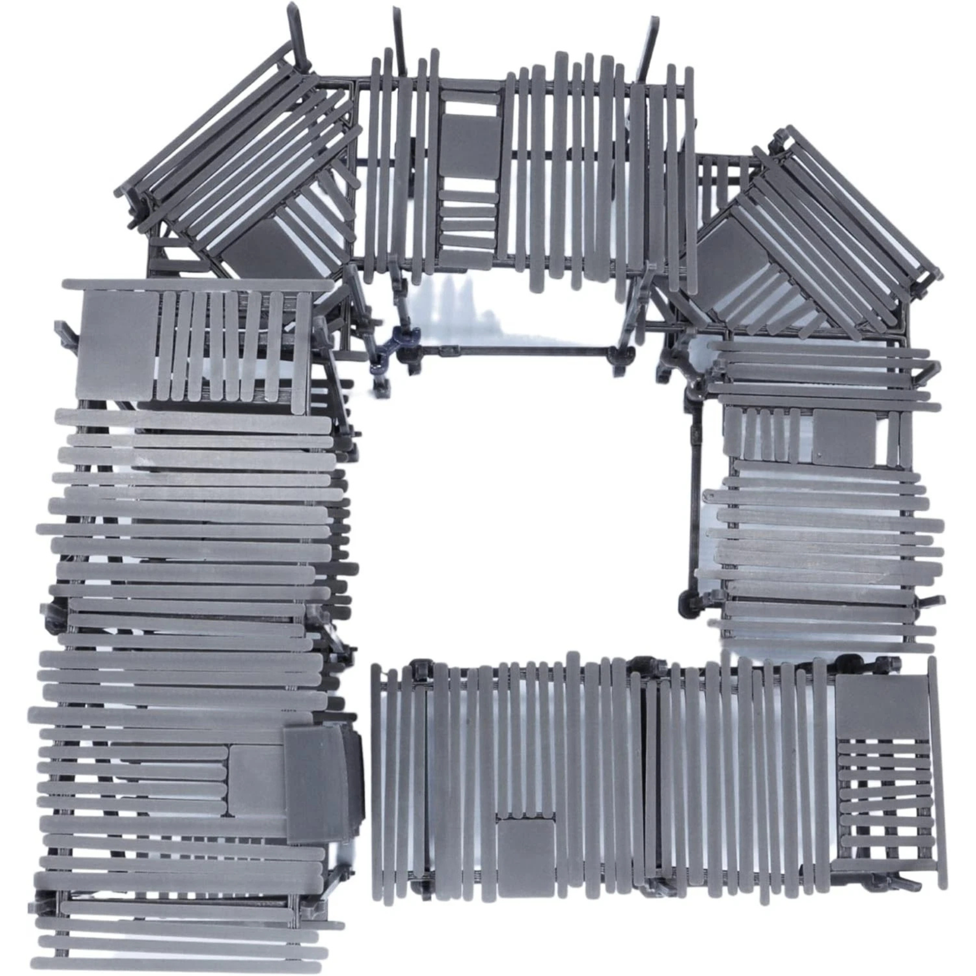 Top-down view of modular scaffolding terrain set showing connected walkways, platforms, ladders, and open central space.