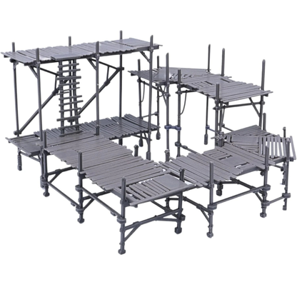 Unpainted modular scaffolding set showing multiple platform sections, ladders, supports, and walkways in grey resin.