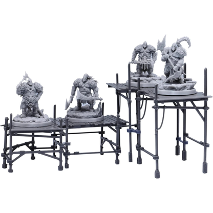 Scaffolding terrain arranged as elevated platforms with miniatures standing on walkways for a fantasy or sci-fi battle scene.