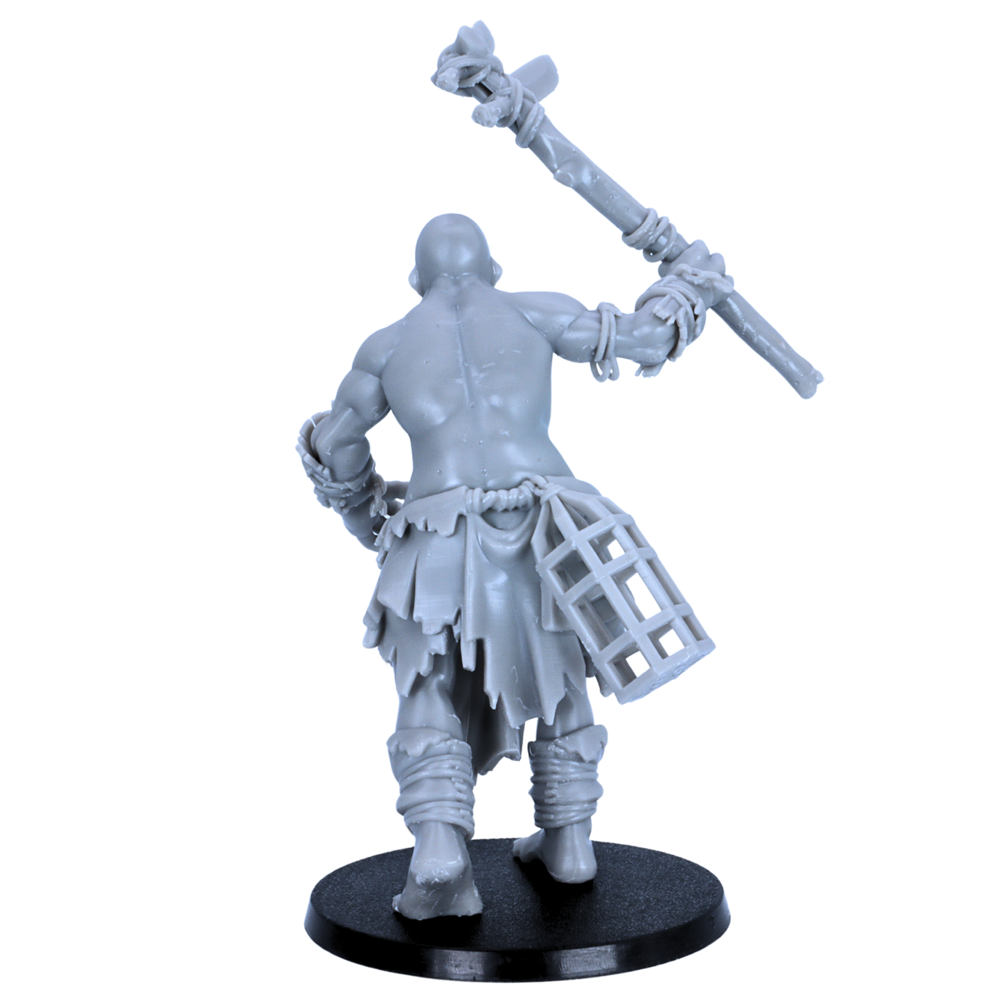 Rear view of unpainted Mountain Giant miniature showing back muscles, raised weapon, torn cloth, and cage accessory.