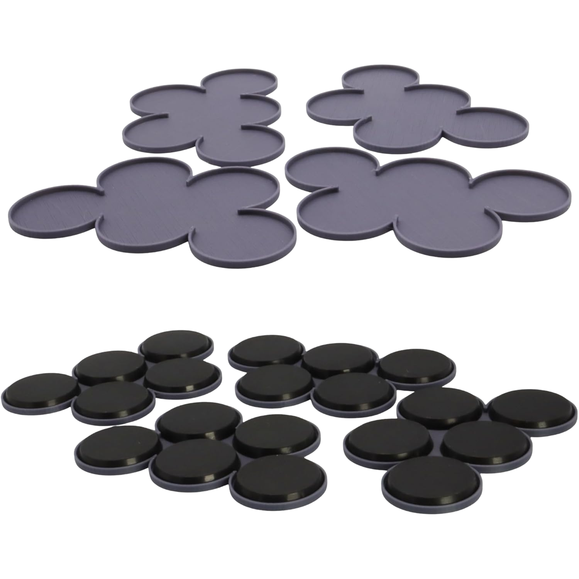 Angled view of four miniature movement trays showing their low-profile raised edges and five-base layouts.