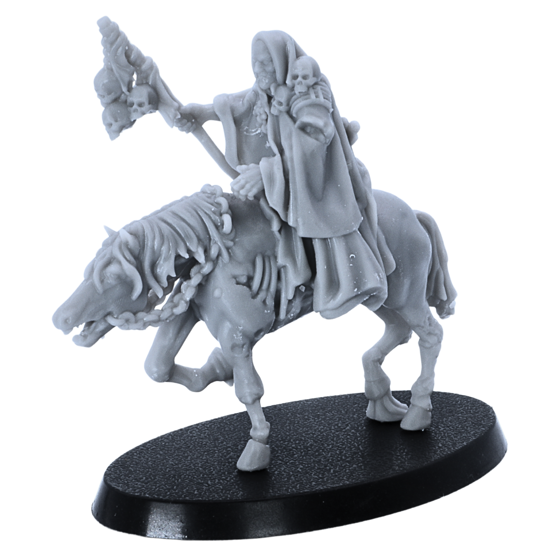 Close view of unpainted Necromancer on horseback miniature showing skull details, robes, and horse sculpting.