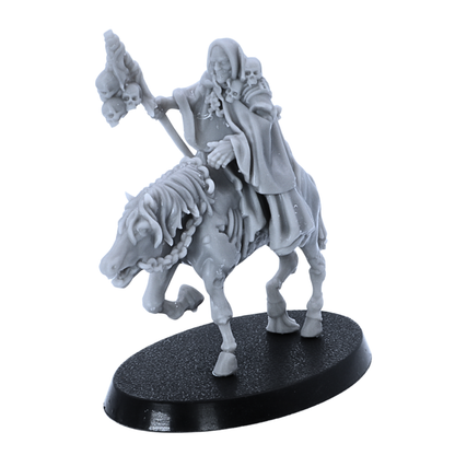 Unpainted mounted Necromancer miniature showing rider, skeletal staff, undead horse, and oval base.