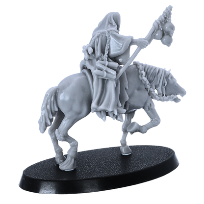 Side view of unpainted Necromancer on horseback miniature with flowing robes, skull staff, and horse details.