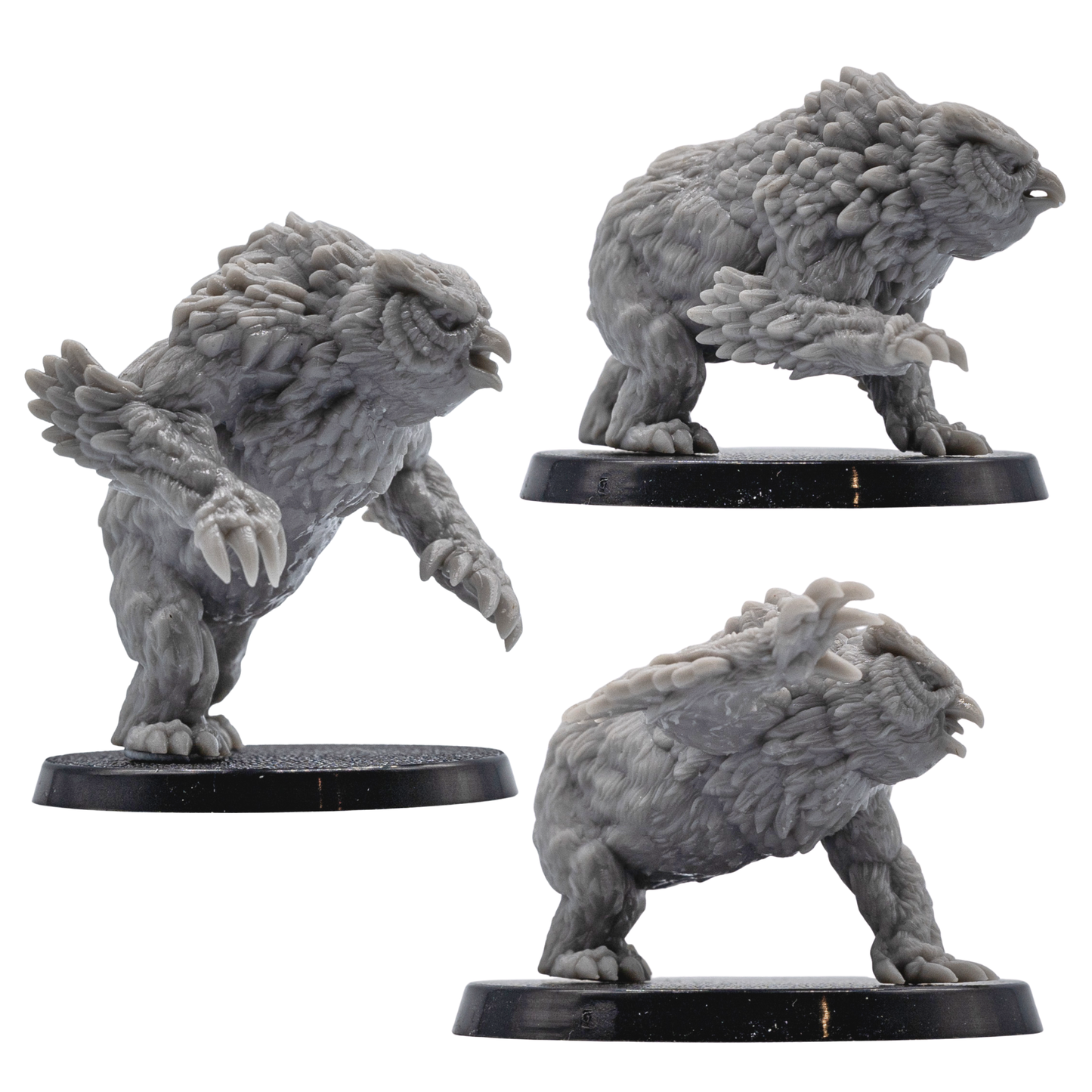 Action pose views of unpainted Owlbear creature miniatures with detailed claws, beaks, feathers, and muscular forms.