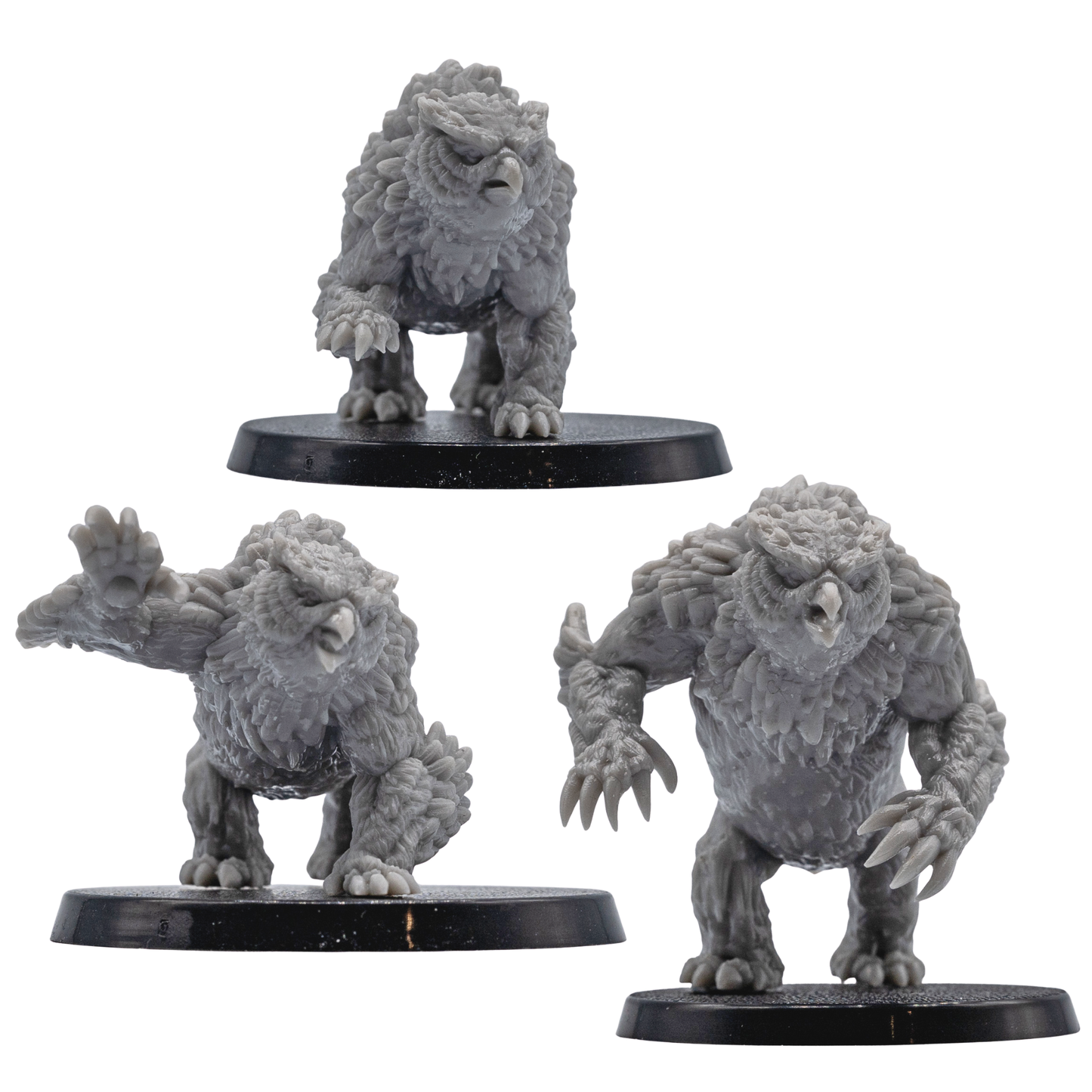 Front views of unpainted Owlbear fantasy creature miniatures showing sculpted feathers, claws, and resin detail.