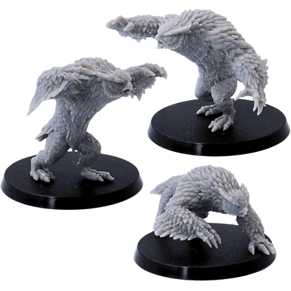 Unpainted set of three Owlbear miniatures showing their different poses and detailed feathered bodies.