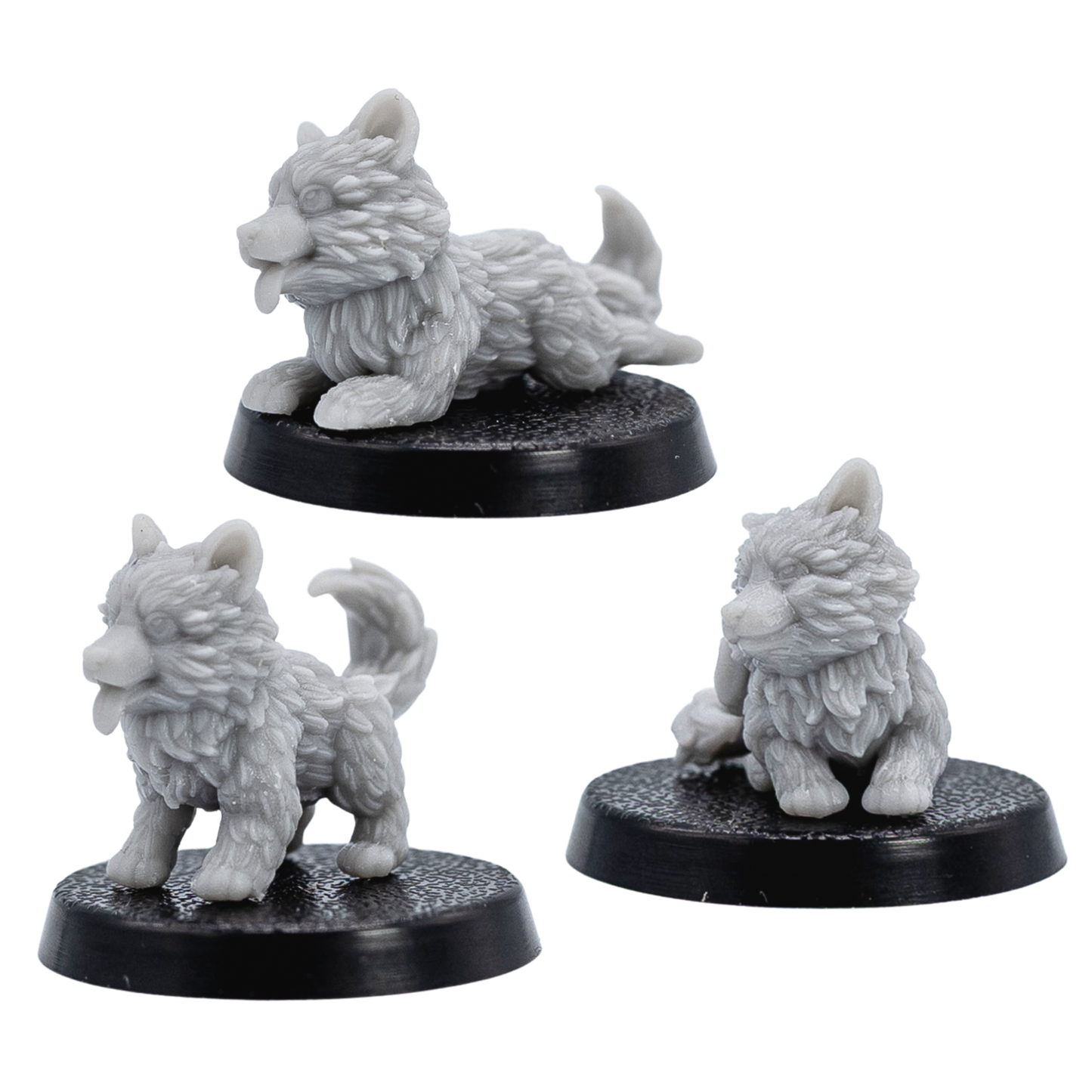Angled views of unpainted Puppy Familiars by Forged Path Miniatures showing all three puppy poses on 25mm round bases.