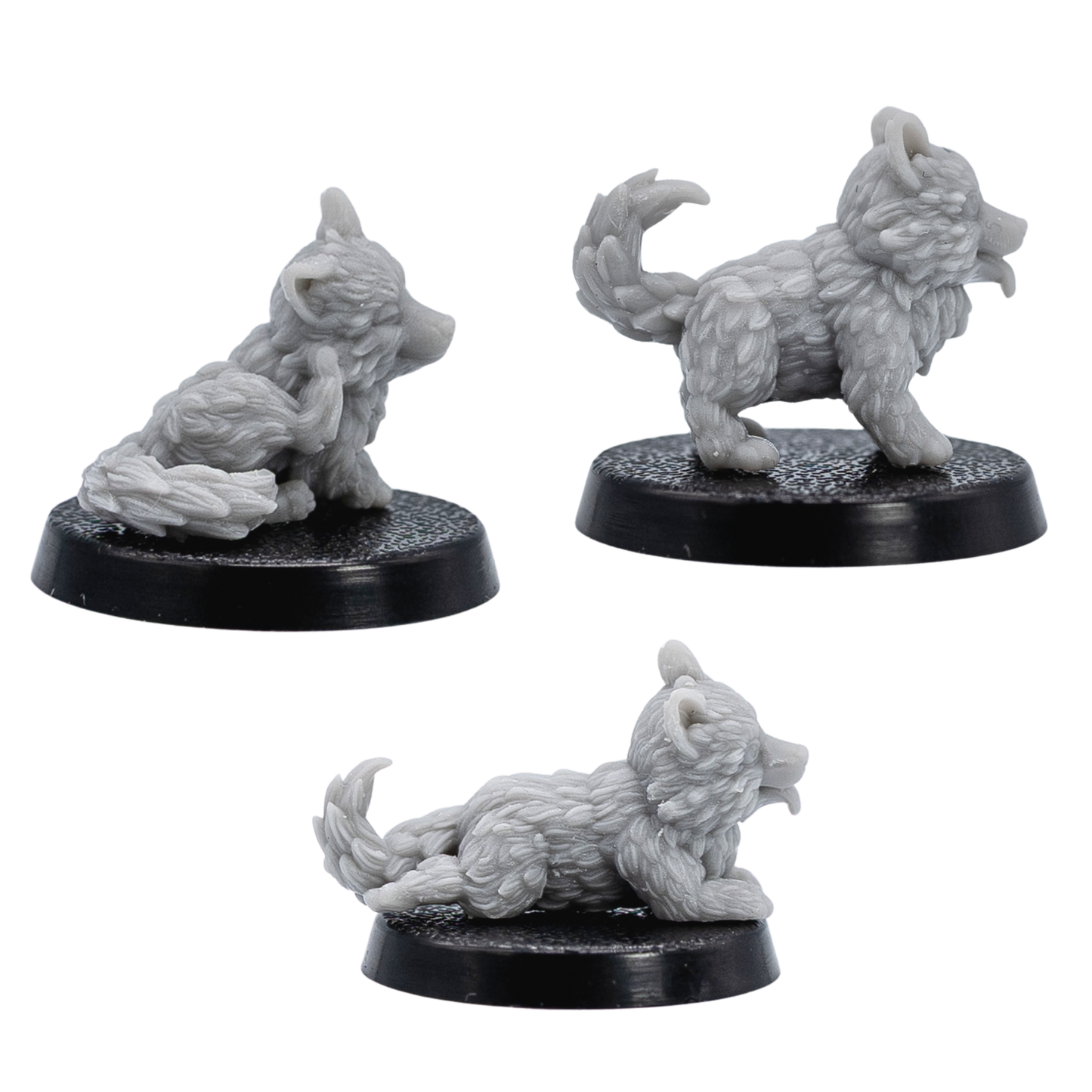 Profile views of unpainted Puppy Familiars showing the lying, standing, and seated puppy sculpts on 25mm round bases.