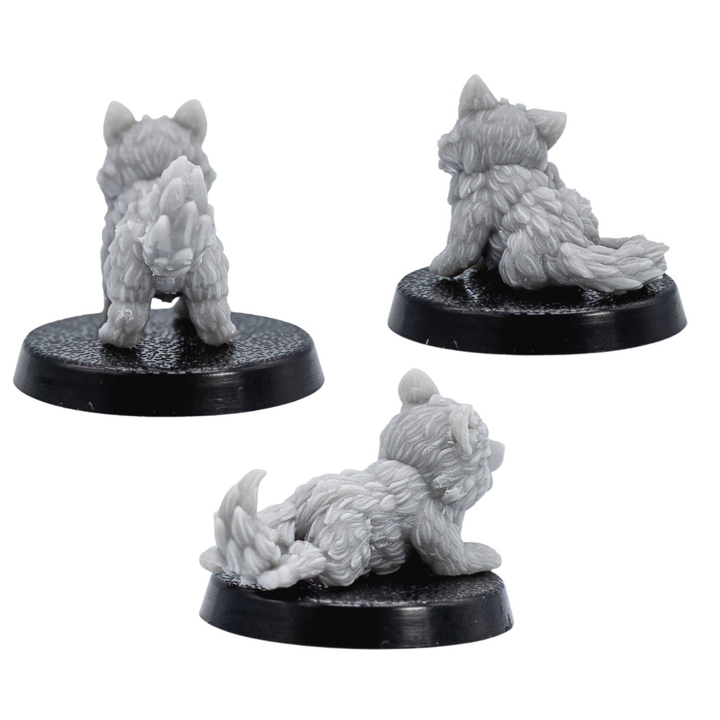 Rear views of unpainted Puppy Familiars showing detailed fluffy fur and tails in grey resin.