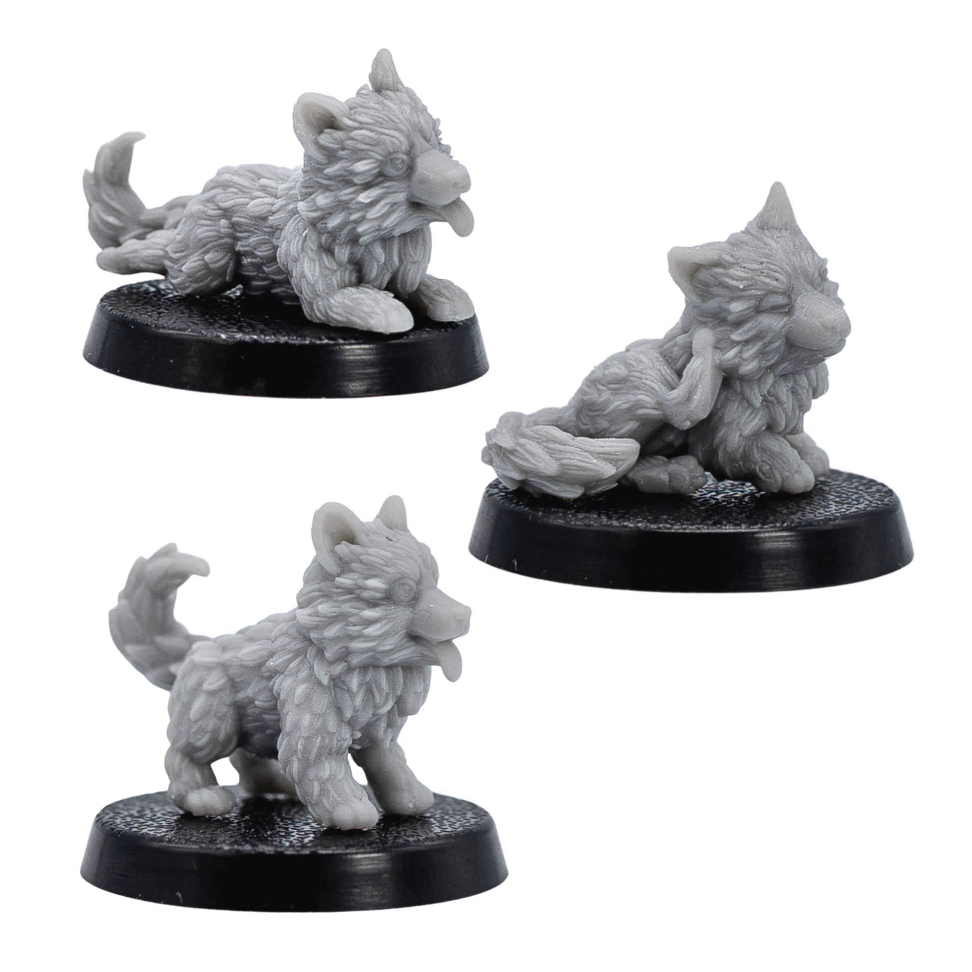 Unpainted Puppy Familiars showing three grey resin puppy miniatures in standing, lying, and seated poses.
