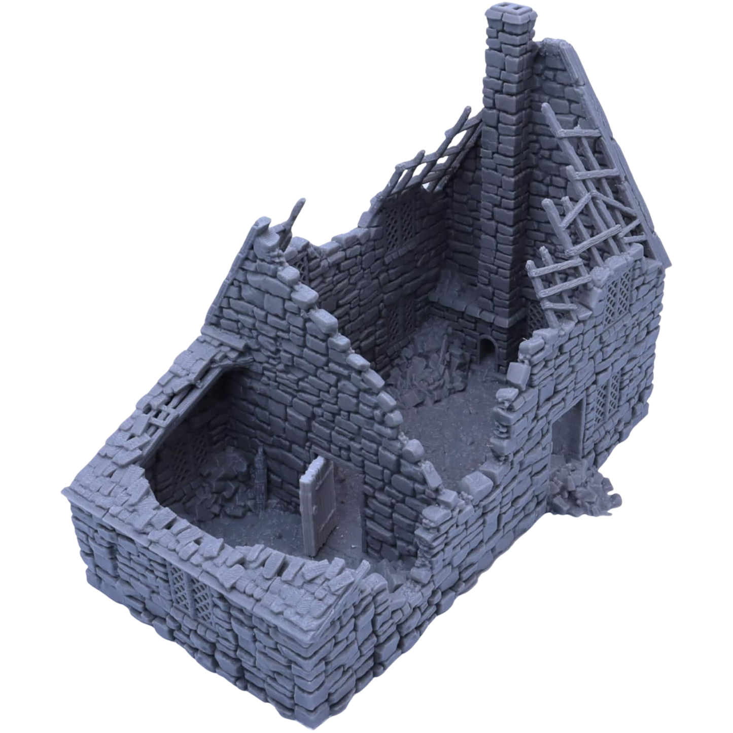 Raised angle view of the Ruined Crow Cottage showing the accessible interior, broken walls, rubble, doorway, and tall chimney.