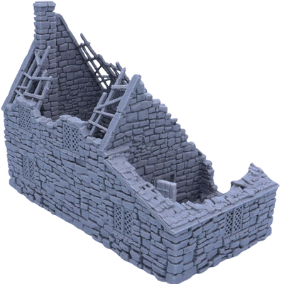 Side and rear angle of the ruined stone cottage showing collapsed masonry, broken roof sections, windows, and open interior.
