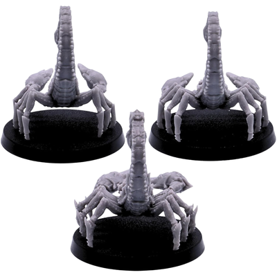 Rear views of three unpainted giant Scorpion miniatures showing segmented tails, multiple jointed legs, and armoured bodies on 50mm round bases.