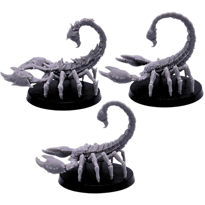 Side views of the Scorpions miniature set showing large claws, low armoured bodies, articulated legs, curved tails, and prominent stingers.