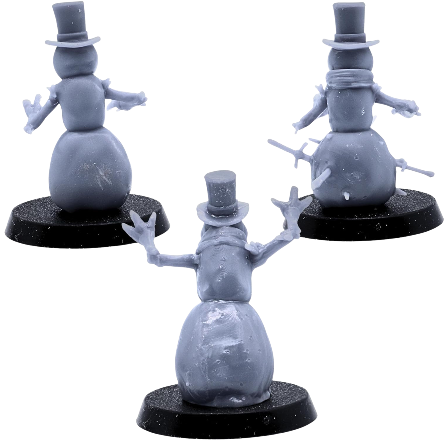 Rear views of the three unpainted Snowmen miniatures showing top hats, branch arms, scarves, snow bodies, and embedded weapons.