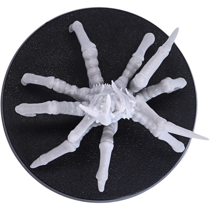 Top-down view of the Spider of Leng miniature showing the full spread of its eight spider legs across the 50mm round base.