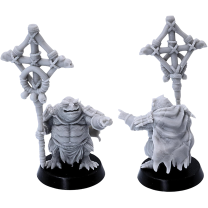 Unpainted Swamp Toad shaman miniature holding a large ritual staff decorated with ropes, bones, skulls, and tribal ornaments.