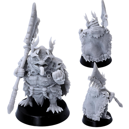 Unpainted Swamp Toad tribal leader by Highlands Miniatures with ornate headdress, spear, cloak, bone decorations, and ritual details.