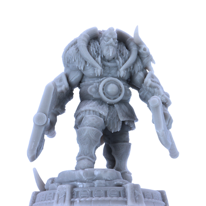 Close-up of unpainted Thane Eboncry resin miniature showing face, fur mantle, horn details, and armour.