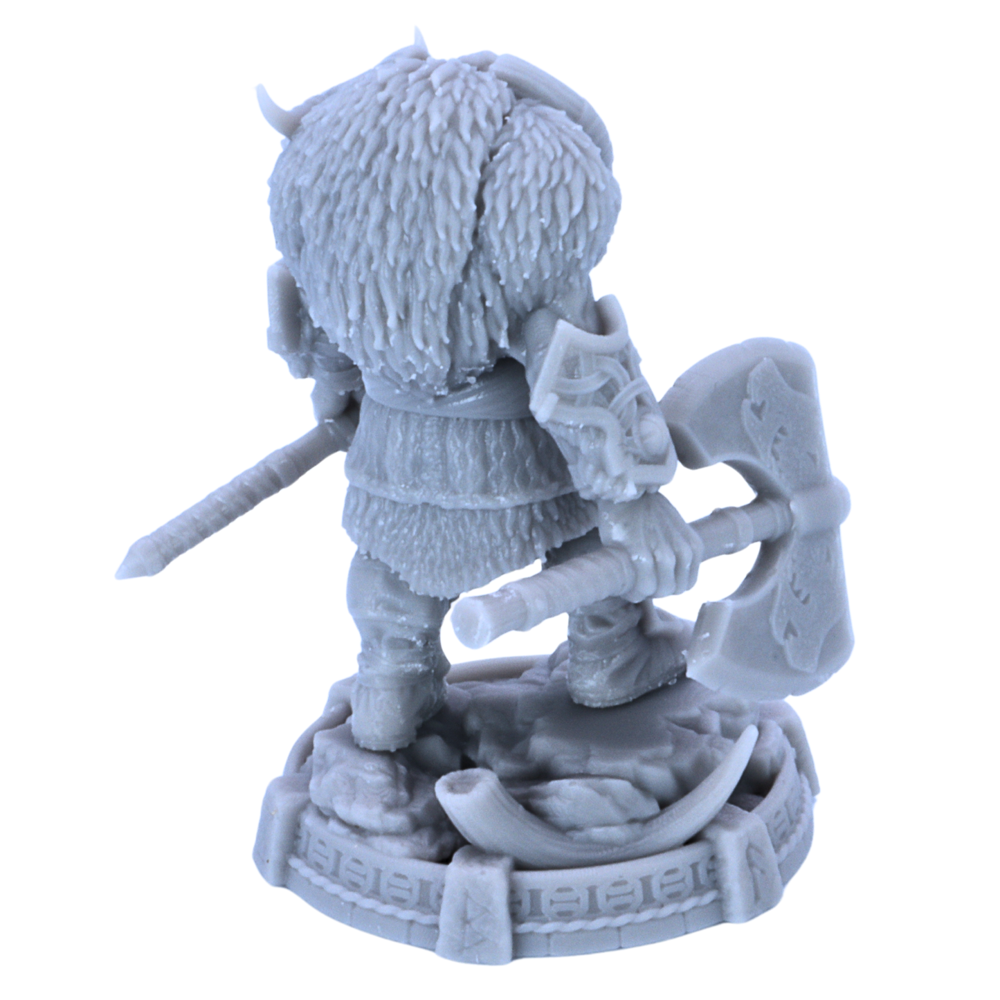 Rear view of unpainted Thane Eboncry miniature showing fur cloak, armour, axes, and scenic base details.