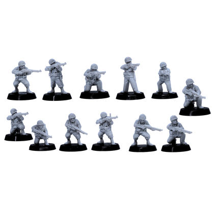 Alt: USMC riflemen miniatures in standing and kneeling combat poses