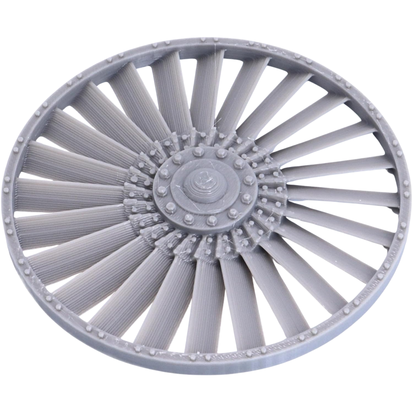Close-up of the removable-style turbine fan component showing radial blades, central hub, and riveted circular frame.
