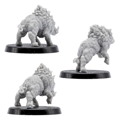 Rear views of unpainted Wild Boar miniatures showing detailed fur, raised manes, tails, muscular legs, and round bases.